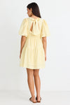 Get ready to indulge in the buttery softness of this yellow mini dress! Its playful tiered design and elastic waist provide both a comfortable fit and a feminine look. With a v neckline and drapey puff sleeves, this dress flatters your silhouette. And don't forget the charming bow and open back for added flair!