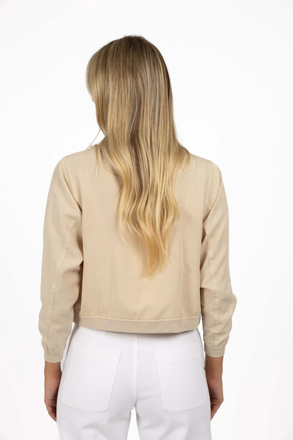 The Cruise Jacket is a lightweight, year-round essential crafted from 100% Lyocell — a soft, breathable, and eco-friendly fabric. This classic zip-up style features full-length sleeves with band cuffs, elasticised cotton trims, and practical front pockets. Designed to sit at the hip, it’s the perfect go-to jacket for everyday layering.