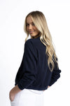 The Cruise Jacket is a lightweight, year-round essential crafted from 100% Lyocell — a soft, breathable, and eco-friendly fabric. This classic zip-up style features full-length sleeves with band cuffs, elasticised cotton trims, and practical front pockets. Designed to sit at the hip, it’s the perfect go-to jacket for everyday layering.