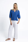 Crafted from a breathable, eco-friendly linen, cotton ramie, and tencel blend

Flattering V-neckline with self-covered button closure

Pintuck detailing on shoulders for subtle texture

Roomy sleeves with trim and elastic cuffs for versatile styling

Relaxed fit pairs easily with jeans, shorts, or linen pants