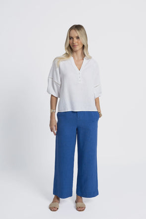 Crafted from a breathable, eco-friendly linen, cotton ramie, and tencel blend

Flattering V-neckline with self-covered button closure

Pintuck detailing on shoulders for subtle texture

Roomy sleeves with trim and elastic cuffs for versatile styling

Relaxed fit pairs easily with jeans, shorts, or linen pants