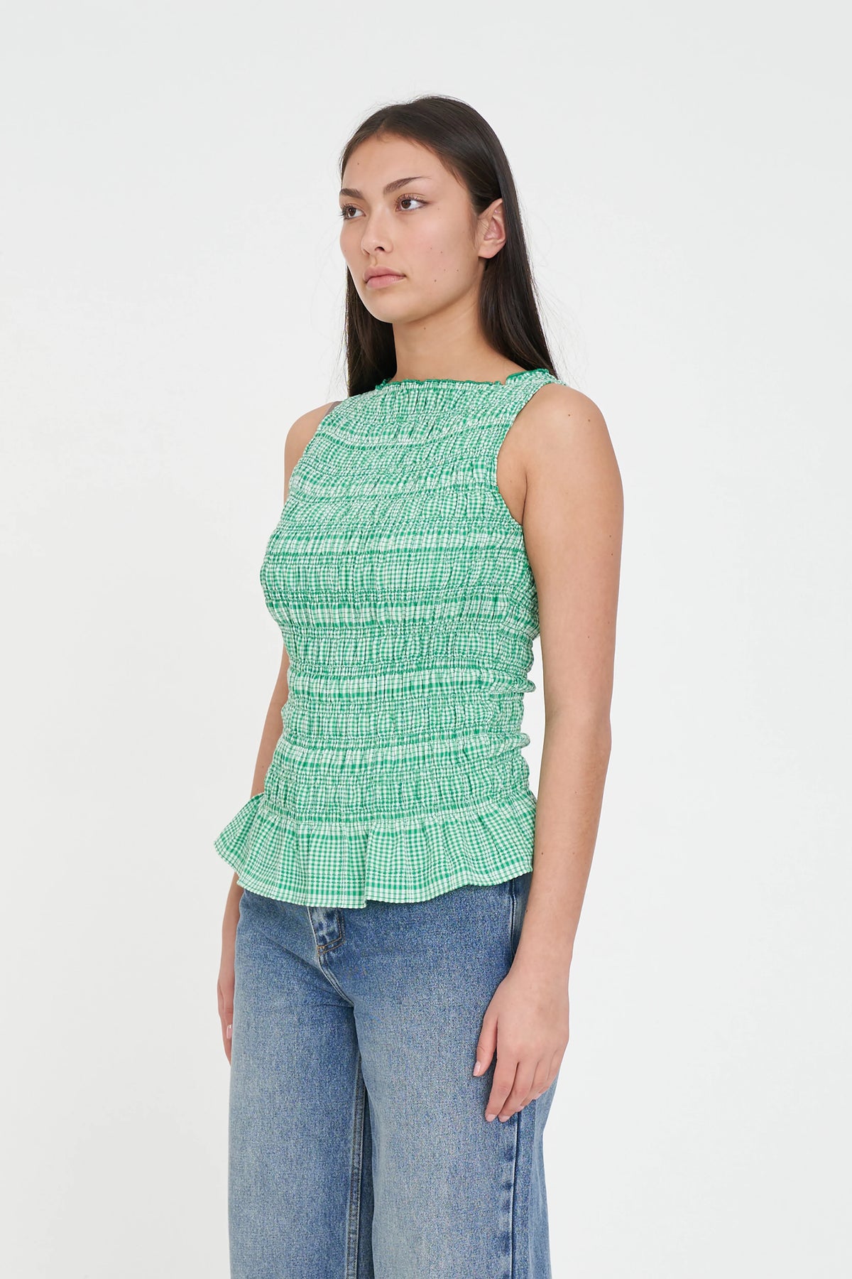 Shirred bodice for a comfy, flexible fit
Cute ruffle hem for a feminine finish
Sleeveless silhouette
Easy crew neckline
Perfect for work, weekends and everything in between