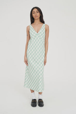 Refresh your wardrobe with the effortlessly chic Celine Midi Dress. A modern take on classic gingham, this piece features a fresh Matcha green and white diagonal check that feels both sophisticated and playful.