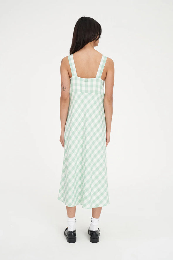 Refresh your wardrobe with the effortlessly chic Celine Midi Dress. A modern take on classic gingham, this piece features a fresh Matcha green and white diagonal check that feels both sophisticated and playful.