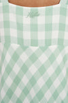 Refresh your wardrobe with the effortlessly chic Celine Midi Dress. A modern take on classic gingham, this piece features a fresh Matcha green and white diagonal check that feels both sophisticated and playful.