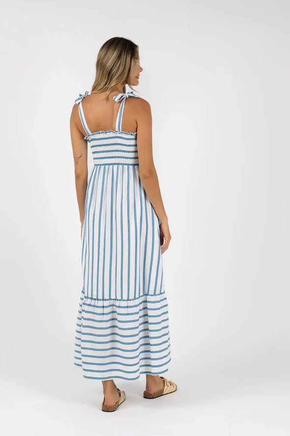 Introducing the Santos Shirred Dress, your new go-to maxi for effortless style. Crafted with our unique Humidity woven design and adjustable self-fabric straps for a bra-friendly fit, it flatters all body types with a shirred elastic bodice and frilled hem. Made of soft cotton and featuring a stunning contrast woven stripe, this dress is both chic and comfortable. Plus, it's maternity-friendly for added versatility.