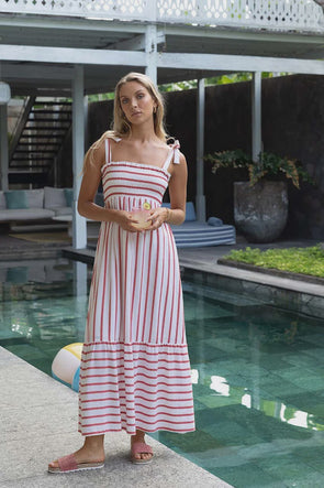 Introducing the Santos Shirred Dress, your new go-to maxi for effortless style. Crafted with our unique Humidity woven design and adjustable self-fabric straps for a bra-friendly fit, it flatters all body types with a shirred elastic bodice and frilled hem. Made of soft cotton and featuring a stunning contrast woven stripe, this dress is both chic and comfortable. Plus, it's maternity-friendly for added versatility.