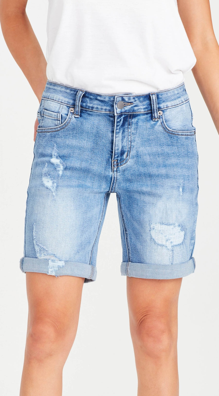 Mid/high waisted long shorts with a super comfy soft stretch denim and a rolled cuff.

The main rip is patched and crossed stitched to give you that ripped look but without the hole & a great relaxed fit summer short with distressed front panels and light distressing on the rear pockets.