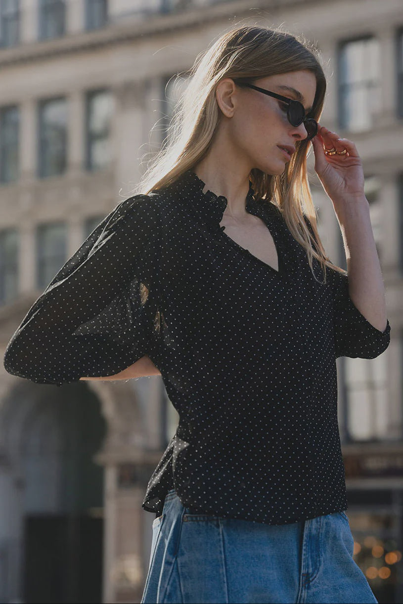 Elegant high neckline with delicate button-front detailing
Lightweight sheer fabrication with soft movement
Mid-length balloon sleeves for subtle volume
Timeless mini polka dot print
Relaxed, floaty silhouette designed for versatile styling
Easy to dress up or down
Fabric: 100% Polyester