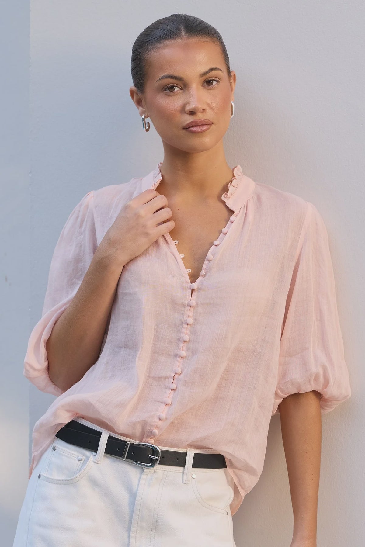 - Ruffled high neckline
- Mid-length balloon sleeves
- Covered button-front detail
- Relaxed silhouette
- Lightweight ramie fabrication
- Natural fibre
- Fabric Composition - 100% Ramie