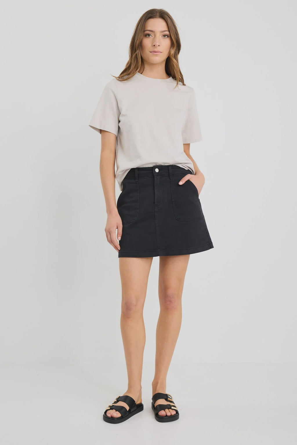 - Washed black denim for a casual, lived-in look
- Front patch pockets for practical detailing
- Zip and button closure for secure wear
- Mini length with a straight silhouette
- Comfortable stretch blend for flexibility
- Fabric composition: 98% Cotton, 2% Elastane