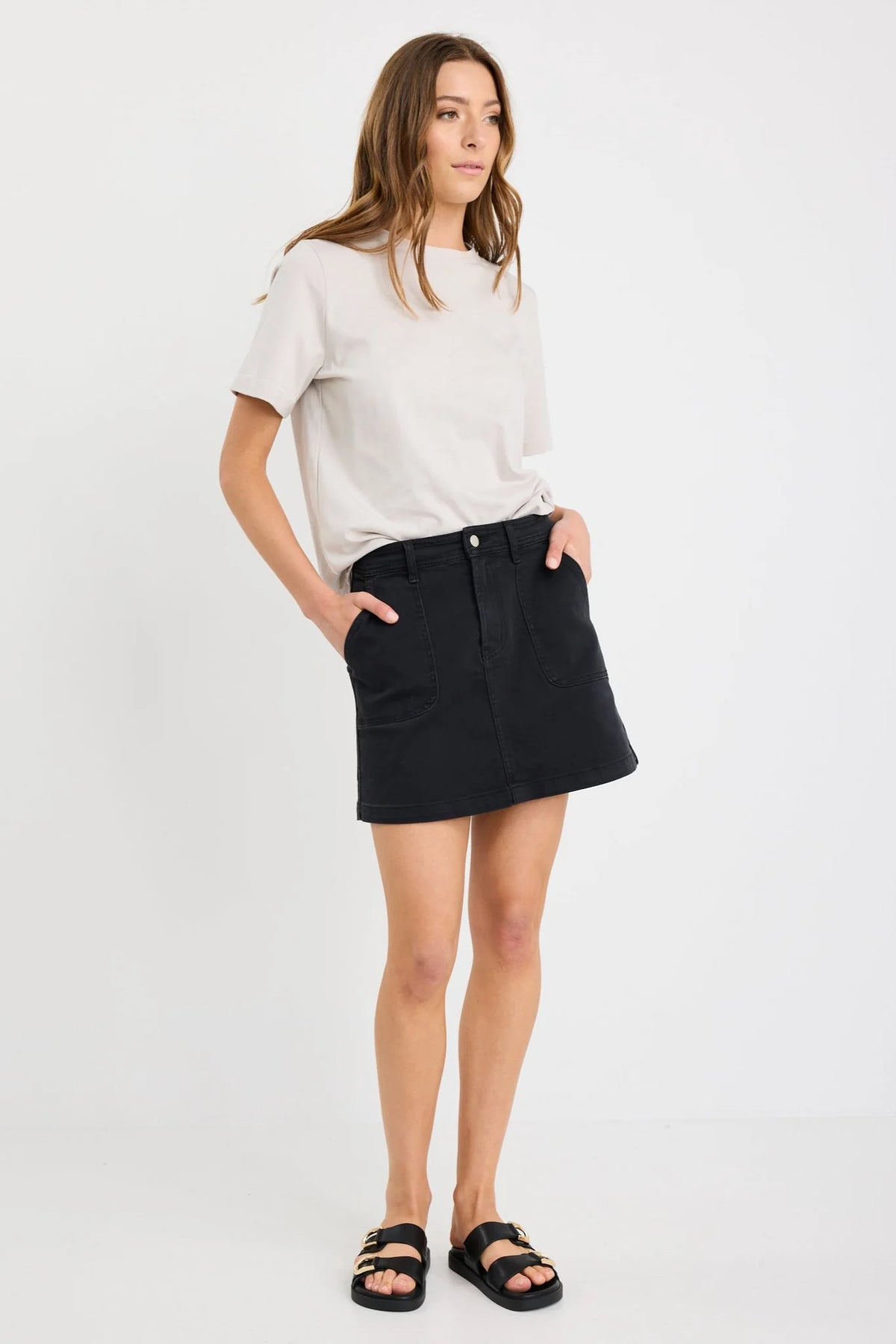 - Washed black denim for a casual, lived-in look
- Front patch pockets for practical detailing
- Zip and button closure for secure wear
- Mini length with a straight silhouette
- Comfortable stretch blend for flexibility
- Fabric composition: 98% Cotton, 2% Elastane