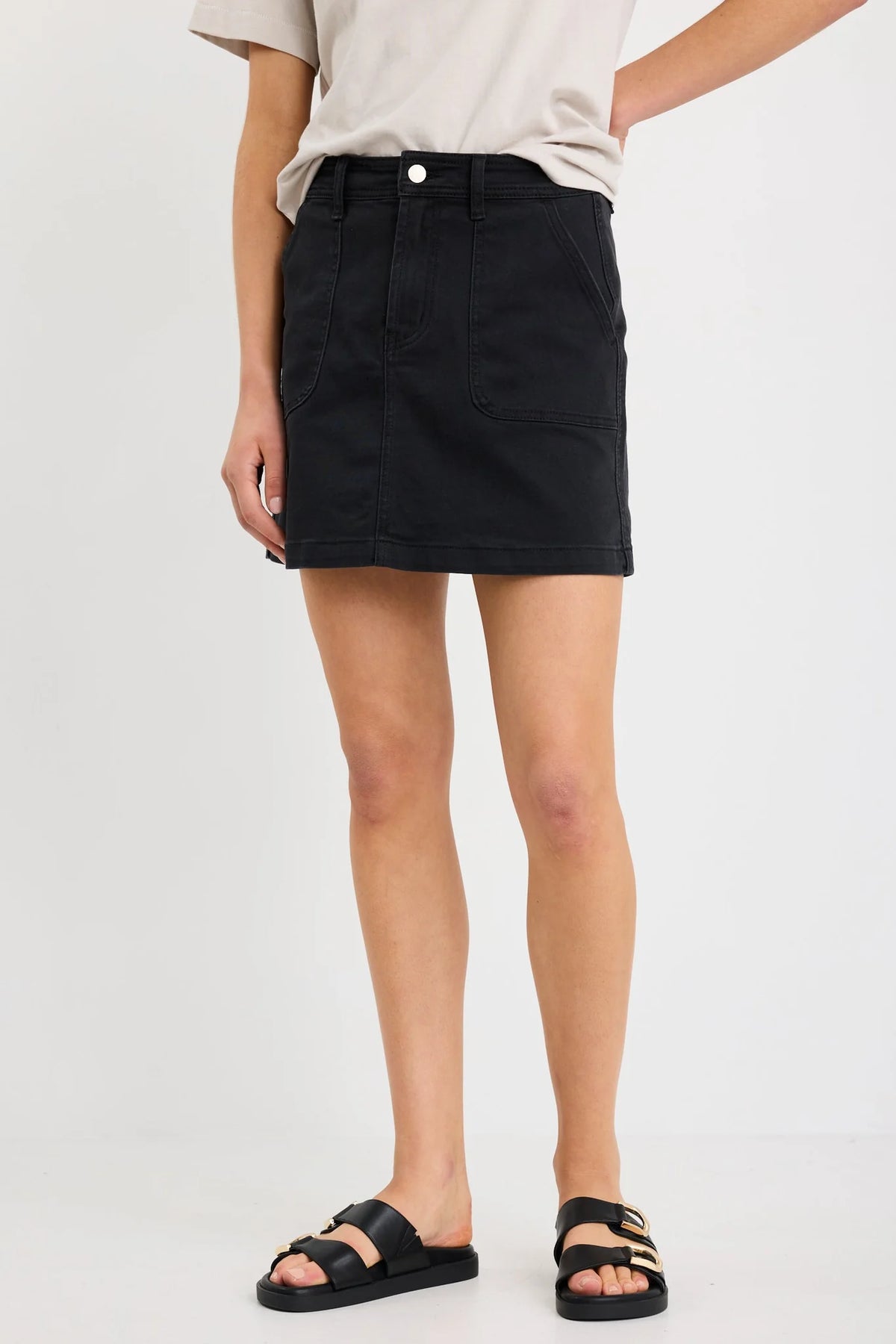 - Washed black denim for a casual, lived-in look
- Front patch pockets for practical detailing
- Zip and button closure for secure wear
- Mini length with a straight silhouette
- Comfortable stretch blend for flexibility
- Fabric composition: 98% Cotton, 2% Elastane