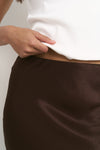 - Pull-on style with comfortable elastic waist
- Bias cut creates a softly draped silhouette
- Chocolate hue in silky rayon-viscose blend
- Midi length offers versatile styling options
- Delicate fabric with a luxurious silky feel, 60% Rayon, 40% Viscose