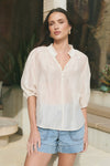 Start your day with a playful twist in the Closure Top. Featuring a high neck with charming frill details and a button front, this top also boasts mid-length balloon sleeves for added fun. Made from a semi-sheer linen blend, it offers breathable comfort that’s perfect for any occasion.