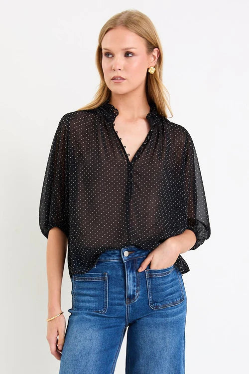 Elegant high neckline with delicate button-front detailing
Lightweight sheer fabrication with soft movement
Mid-length balloon sleeves for subtle volume
Timeless mini polka dot print
Relaxed, floaty silhouette designed for versatile styling
Easy to dress up or down
Fabric: 100% Polyester