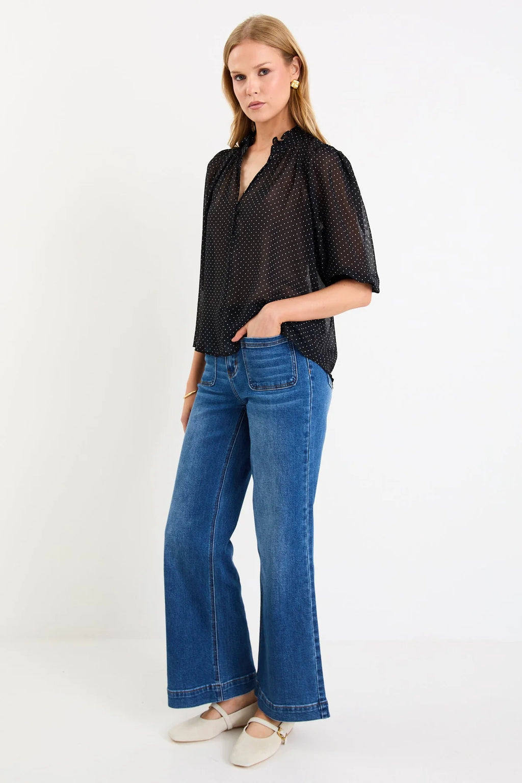 Elegant high neckline with delicate button-front detailing
Lightweight sheer fabrication with soft movement
Mid-length balloon sleeves for subtle volume
Timeless mini polka dot print
Relaxed, floaty silhouette designed for versatile styling
Easy to dress up or down
Fabric: 100% Polyester