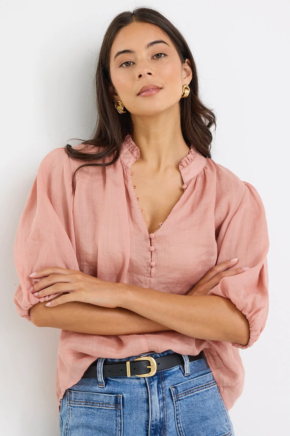 High neck blouse with frill detailing

Elegant button front design

Mid-length balloon sleeves for a feminine touch

Semi-sheer 100% Ramie fabric – lightweight and breathable

Effortless styling from day to night
