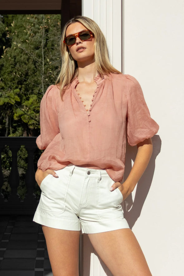 High neck blouse with frill detailing

Elegant button front design

Mid-length balloon sleeves for a feminine touch

Semi-sheer 100% Ramie fabric – lightweight and breathable

Effortless styling from day to night