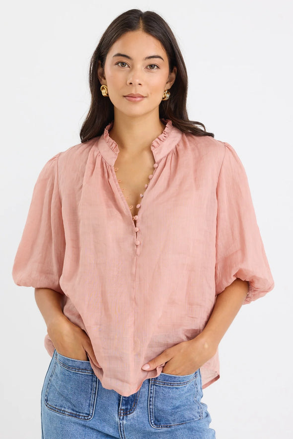 High neck blouse with frill detailing

Elegant button front design

Mid-length balloon sleeves for a feminine touch

Semi-sheer 100% Ramie fabric – lightweight and breathable

Effortless styling from day to night