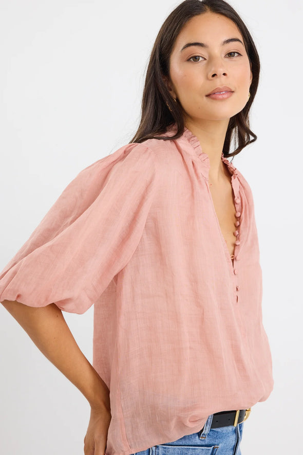 High neck blouse with frill detailing

Elegant button front design

Mid-length balloon sleeves for a feminine touch

Semi-sheer 100% Ramie fabric – lightweight and breathable

Effortless styling from day to night