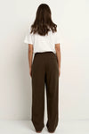 - Mid-rise waistband with flat front and elastic back
- Zip and button closure for a clean tailored finish
- Wide leg shape offers movement and fluidity
- Functional side pockets add practicality
- Crafted in a soft viscose blend, 94% Viscose 6% Polyester