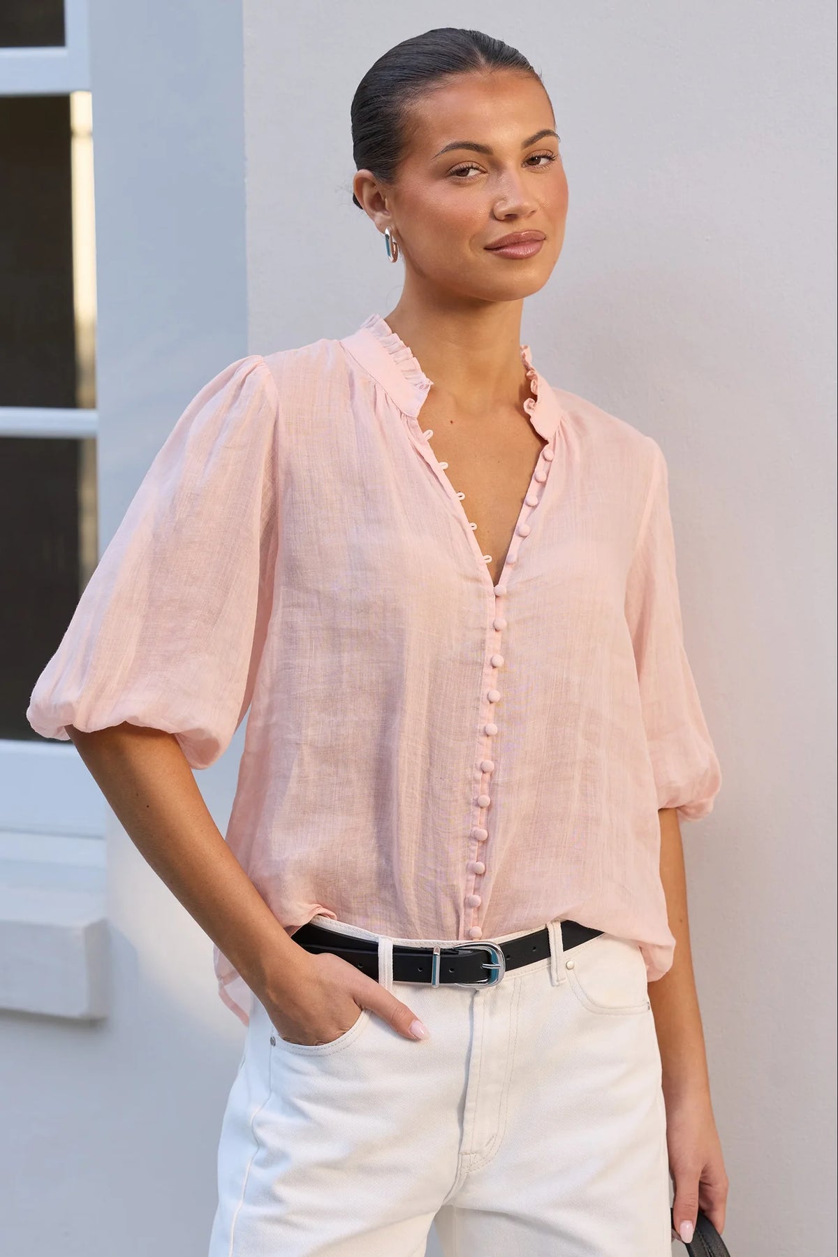 - Ruffled high neckline
- Mid-length balloon sleeves
- Covered button-front detail
- Relaxed silhouette
- Lightweight ramie fabrication
- Natural fibre
- Fabric Composition - 100% Ramie