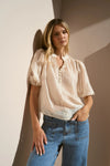 Start your day with a playful twist in the Closure Top. Featuring a high neck with charming frill details and a button front, this top also boasts mid-length balloon sleeves for added fun. Made from a semi-sheer linen blend, it offers breathable comfort that’s perfect for any occasion.