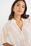 Start your day with a playful twist in the Closure Top. Featuring a high neck with charming frill details and a button front, this top also boasts mid-length balloon sleeves for added fun. Made from a semi-sheer linen blend, it offers breathable comfort that’s perfect for any occasion.