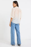 Start your day with a playful twist in the Closure Top. Featuring a high neck with charming frill details and a button front, this top also boasts mid-length balloon sleeves for added fun. Made from a semi-sheer linen blend, it offers breathable comfort that’s perfect for any occasion.