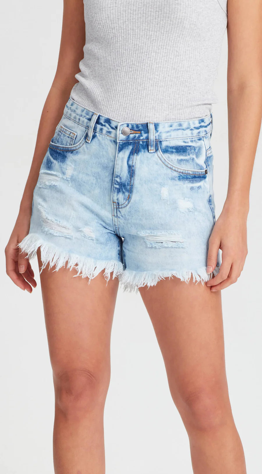 The famous Sofia shorts by Junkfood are always a fast seller and a real favourite. Perfectly distressed and a mid rise these look great fitted or looser and lower on the waist. Rigid but soft denim shorts with ripped front panels and a raw hem.

Fixed waist band with belt loops, 100% cotton, zip fly, classic 5 pocket design. Rips and holes will naturally continue to grow.
