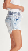 Rigid denim frayed shorts with an elastic waist band and shoe string tie. In the perfect faded light blue.

Can be worn higher or lower on the waist as preferred. Medium length with good coverage.