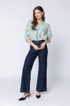 Pretty sage-green base with white bloom print

Relaxed, easy fit

Elbow-length sleeves

Lightweight and breathable

Perfect for pairing with jeans or summer skirts

Composition: 70% Viscose, 30% Nylon