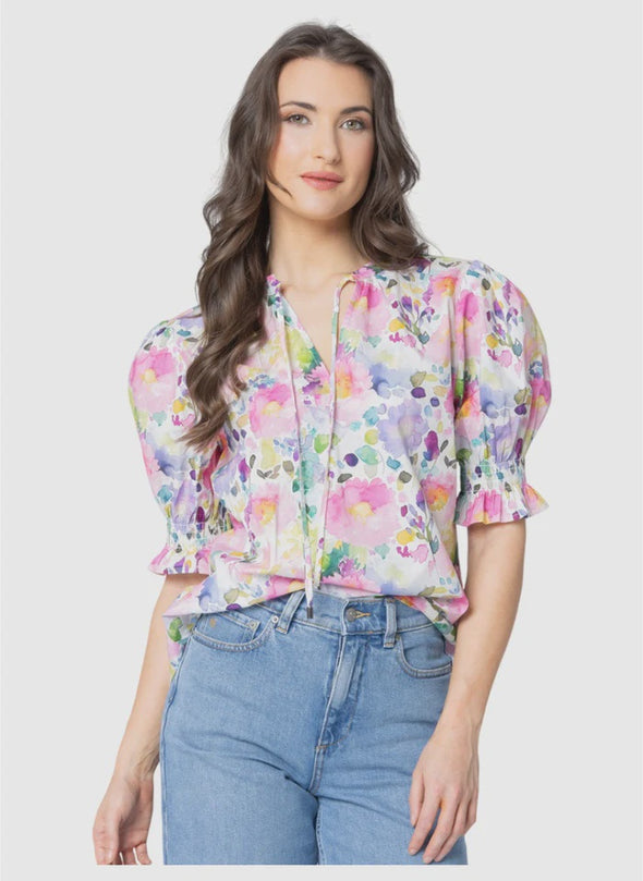 All-over patterned design

Gathered neckline for soft, feminine shaping

V-neckline with adjustable tie detail

Elasticated ruffle cuffs for a romantic finish

Standard fit with no stretch

Lightweight, floaty silhouette perfect for tucking or wearing loose