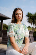 Soft green patchwork-inspired floral print
Gathered neckline
Relaxed, feminine silhouette
Lace trim sleeve detailing
Lightweight and breathable 100% cotton
100% Cotton