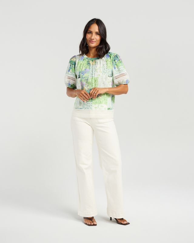 Soft green patchwork-inspired floral print
Gathered neckline
Relaxed, feminine silhouette
Lace trim sleeve detailing
Lightweight and breathable 100% cotton
100% Cotton