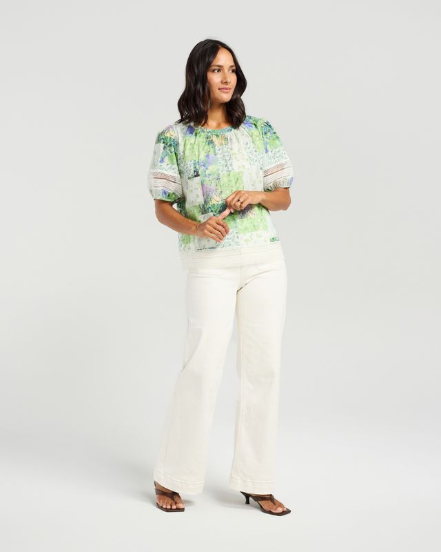 Soft green patchwork-inspired floral print
Gathered neckline
Relaxed, feminine silhouette
Lace trim sleeve detailing
Lightweight and breathable 100% cotton
100% Cotton