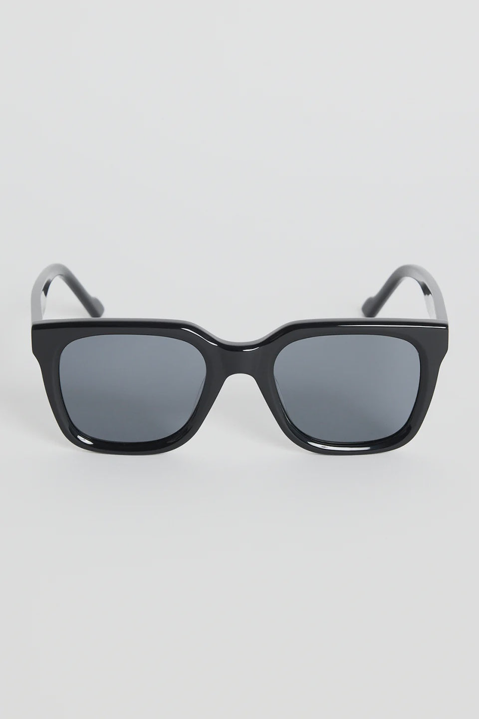 The Napoli Black Rounded Sunglasses bring a sleek, modern edge to your everyday look. Designed with a bold square-rounded silhouette, this glossy black frame strikes the perfect balance between minimal and statement. The dark tinted lenses keep things clean and refined, making this pair an easy go-to for sunny days, city strolls, and weekend outfits.

A timeless essential that instantly sharpens your style.

- Recycled Acetate

- UV Protection Category 3