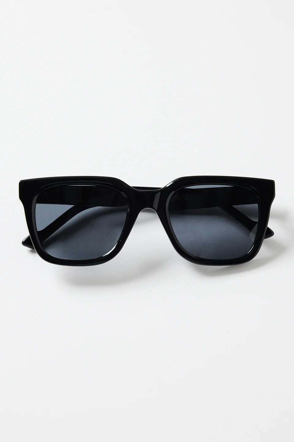 The Napoli Black Rounded Sunglasses bring a sleek, modern edge to your everyday look. Designed with a bold square-rounded silhouette, this glossy black frame strikes the perfect balance between minimal and statement. The dark tinted lenses keep things clean and refined, making this pair an easy go-to for sunny days, city strolls, and weekend outfits.

A timeless essential that instantly sharpens your style.

- Recycled Acetate

- UV Protection Category 3