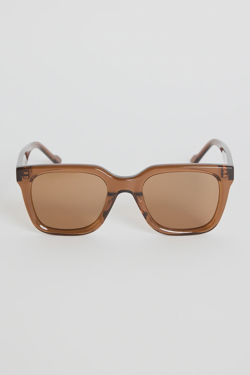 The Napoli Espresso Rounded Sunglasses bring a warm, modern feel to your everyday rotation. Designed in a rich espresso tone, the softly rounded square frame creates a sleek, flattering silhouette that suits every outfit. Finished with matching brown lenses for a cohesive, elevated look, this pair is all about understated cool and easy styling.

A timeless essential you’ll reach for season after season.

- Recycled Acetate

- UV Protection Category 3