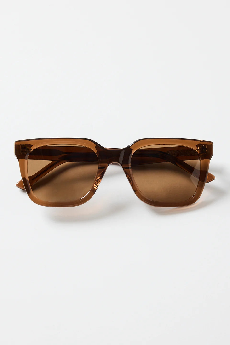 The Napoli Espresso Rounded Sunglasses bring a warm, modern feel to your everyday rotation. Designed in a rich espresso tone, the softly rounded square frame creates a sleek, flattering silhouette that suits every outfit. Finished with matching brown lenses for a cohesive, elevated look, this pair is all about understated cool and easy styling.

A timeless essential you’ll reach for season after season.

- Recycled Acetate

- UV Protection Category 3