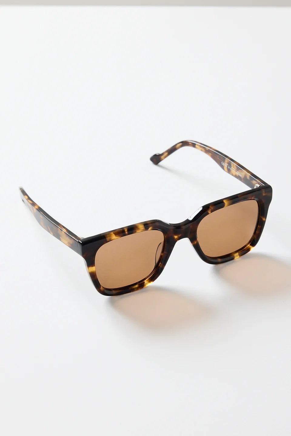 The Napoli Tort Rounded Sunglasses deliver an effortless blend of bold structure and timeless tortoiseshell detail. With a softly rounded square frame and warm brown lenses, this pair adds an elevated finish to every outfit. The glossy tort design brings a classic, versatile touch that works for beach days, brunch plans, and everything in between.

A chic essential you’ll reach for season after season

- Recycled Acetate

- UV Protection Category 3