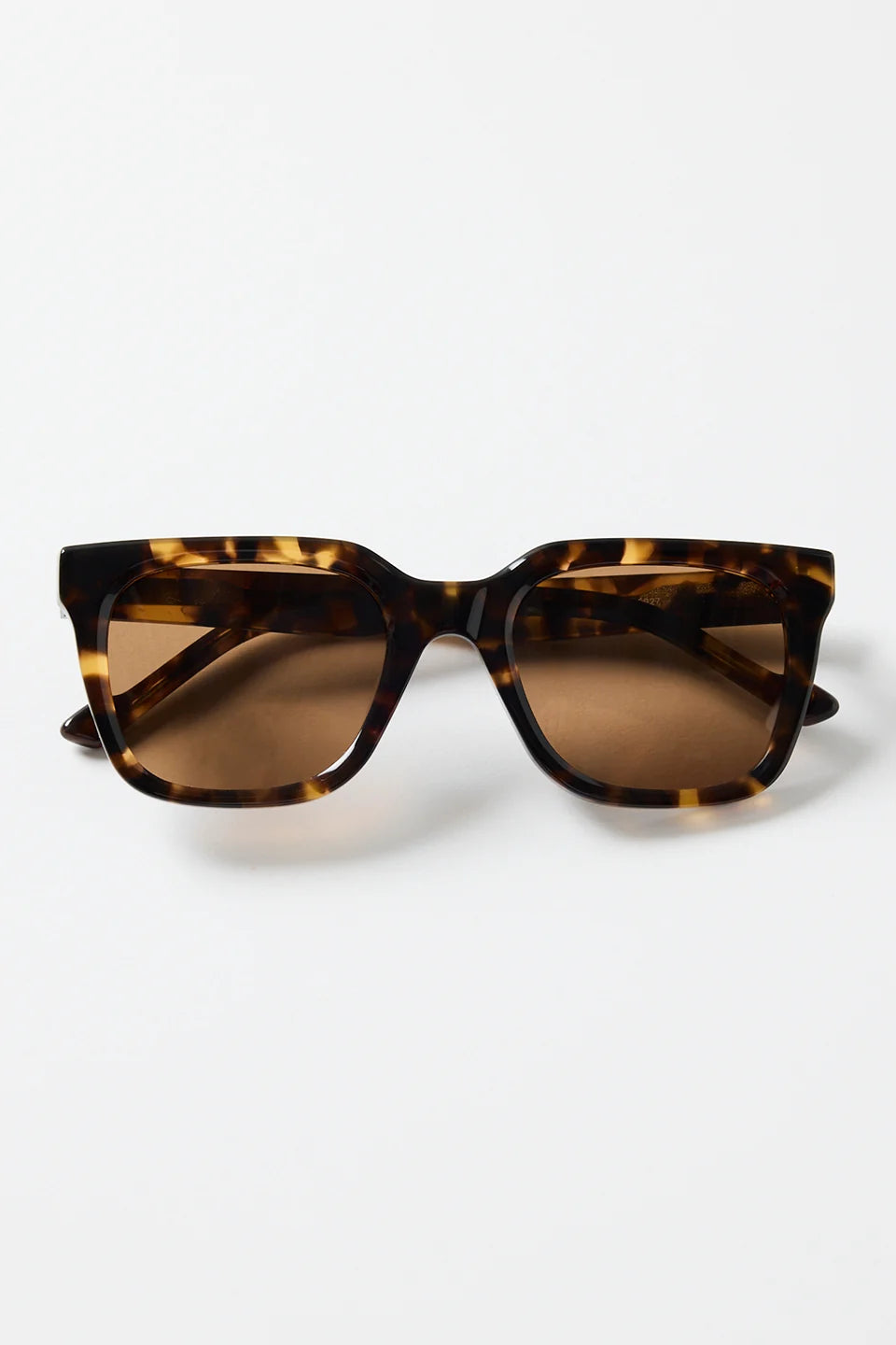 The Napoli Tort Rounded Sunglasses deliver an effortless blend of bold structure and timeless tortoiseshell detail. With a softly rounded square frame and warm brown lenses, this pair adds an elevated finish to every outfit. The glossy tort design brings a classic, versatile touch that works for beach days, brunch plans, and everything in between.

A chic essential you’ll reach for season after season

- Recycled Acetate

- UV Protection Category 3