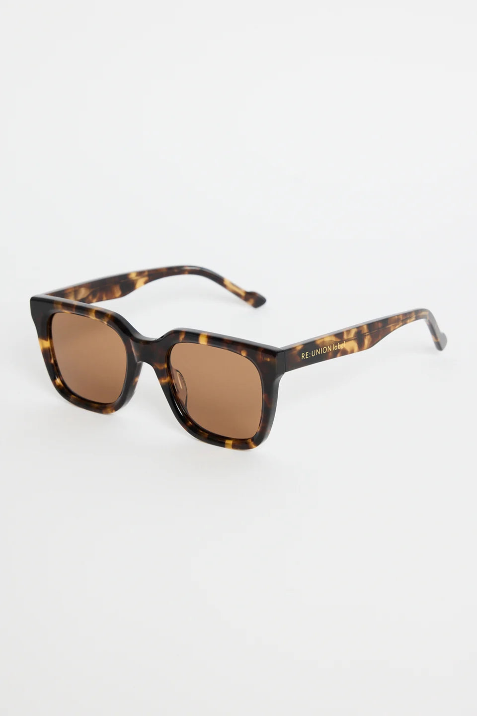 The Napoli Tort Rounded Sunglasses deliver an effortless blend of bold structure and timeless tortoiseshell detail. With a softly rounded square frame and warm brown lenses, this pair adds an elevated finish to every outfit. The glossy tort design brings a classic, versatile touch that works for beach days, brunch plans, and everything in between.

A chic essential you’ll reach for season after season

- Recycled Acetate

- UV Protection Category 3