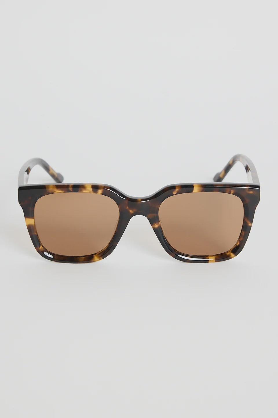 The Napoli Tort Rounded Sunglasses deliver an effortless blend of bold structure and timeless tortoiseshell detail. With a softly rounded square frame and warm brown lenses, this pair adds an elevated finish to every outfit. The glossy tort design brings a classic, versatile touch that works for beach days, brunch plans, and everything in between.

A chic essential you’ll reach for season after season

- Recycled Acetate

- UV Protection Category 3