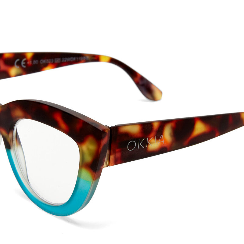 Category: Reading Glasses

Frame colour: Havana and Blue

Iconic Cat Eye silhouette with raised corners and large lenses

Crafted with OKKIA’s signature soft-touch material for comfort

Designed for clarity, comfort, and timeless style