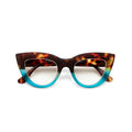 Category: Reading Glasses

Frame colour: Havana and Blue

Iconic Cat Eye silhouette with raised corners and large lenses

Crafted with OKKIA’s signature soft-touch material for comfort

Designed for clarity, comfort, and timeless style