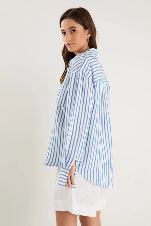 Oversized silhouette for a relaxed, contemporary fit

Long sleeves with button cuffs for versatile rolling and styling

Vertical stripe print for a timeless and flattering look

Full button-front design for easy layering and styling options

Soft, breathable linen-viscose blend for all-day comfort

Fabric: 55% Linen, 45% Viscose