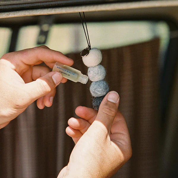 This set includes four unscented felt balls with a branded charm and elastic string, making them easy to hang in your car and a 5mL bottle of our captivating Tobacco and Vanilla fragrance oil, 