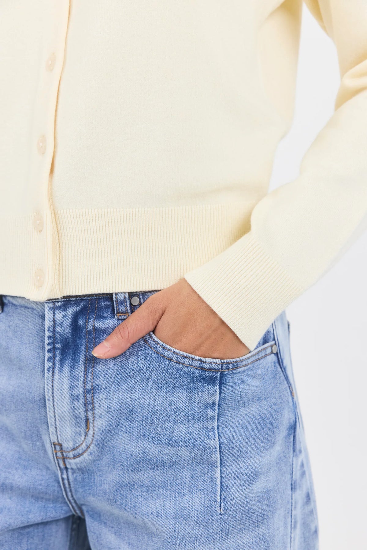 - Long sleeve design
- Crew neckline
- Button-front closure
- Fine gauge knit
- Soft butter colourway
- Ribbed cuffs, neckline and hem
- Fabric - 34% Nylon 34% Viscose 21% Polyester 8% Elastane 3% Cashmere
- Delicate, treat with care